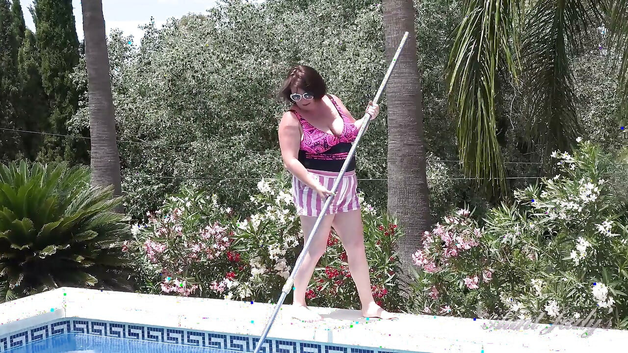 Busty Redhead MILF JoJo Robinson Goes Skinny Dipping in the Pool