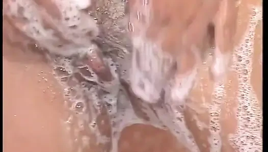 Hairy MILF slut masturbates under shower