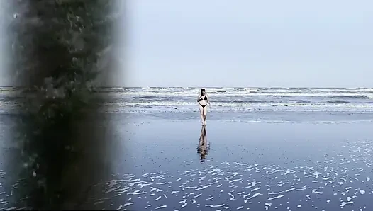 My neighbor loses her clothes at the beach.
