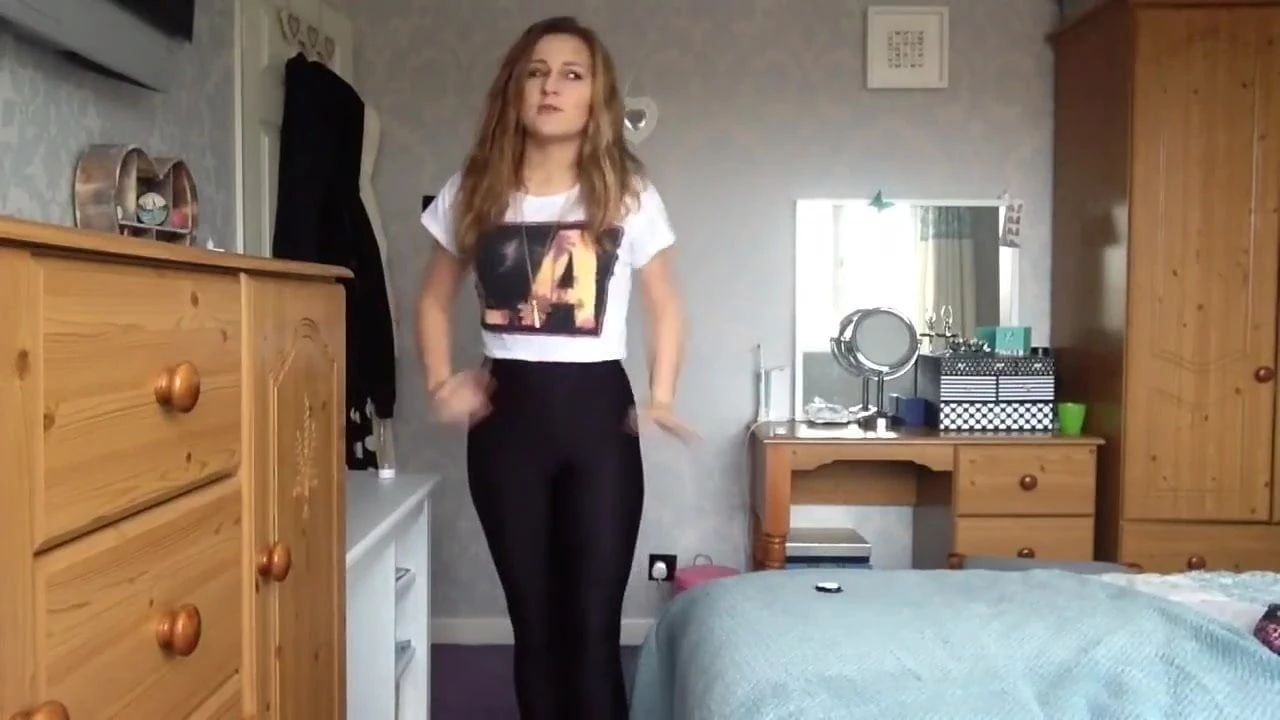 Sexy girl tries on tight and shiny spandex spandex leggings