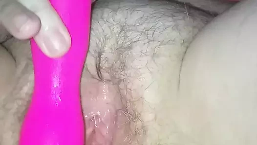 My wife lies and plays with her pussy with a dildo until she has an orgasm