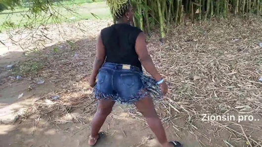 Ebony sexy black girl dances in outdoor with much laughter