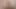 Uzun bacaklı sarışın evli kadın yüksek topuklu ve kırmızı elbiseli striptiz yapıyor