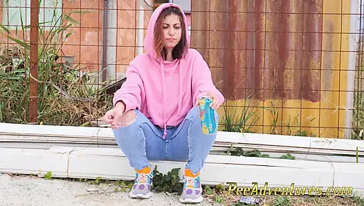 Hipster girl pee in her jeans - changing her wet shorts into dry pants