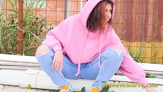 Hipster girl pee in her jeans - changing her wet shorts into dry pants