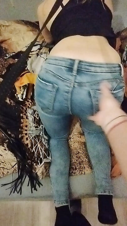 Ass in jeans girl teasing and rubbing pussy