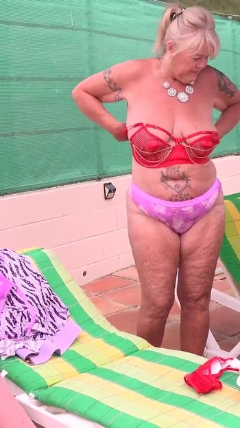 Thrilling moment from "AuntJudysXXX - Busty Mature MILFs Melody Charm, Randy Raz, and JoJo Robinson Gets Naughty by the Pool"