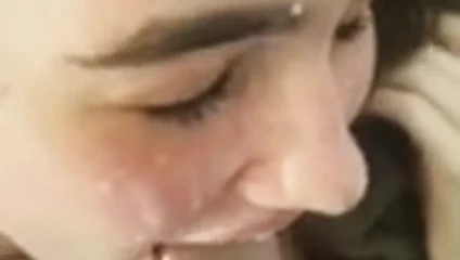 Beautiful brunette receives quick facial blast