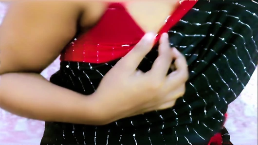 A shy but cute desi girl looks absolutely stunning in her traditional saree, showing off her natural beauty with a teasing and p