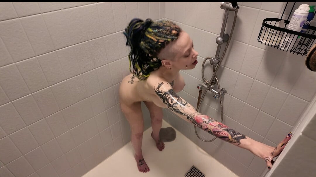 Masturbating in the shower while live on cam