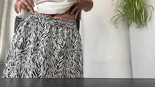 Horny stepmom Michelle puts her sexy feet in high heels on the desk.