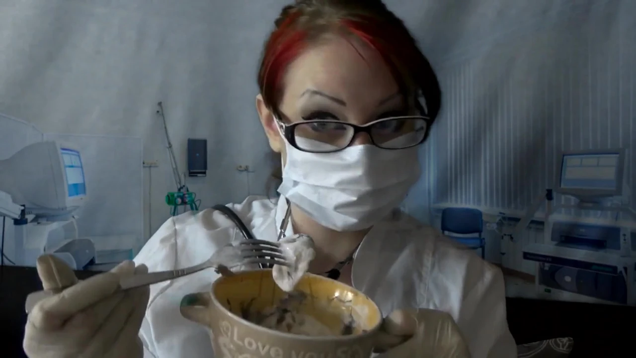 Doctor eating in medical mask and gloves