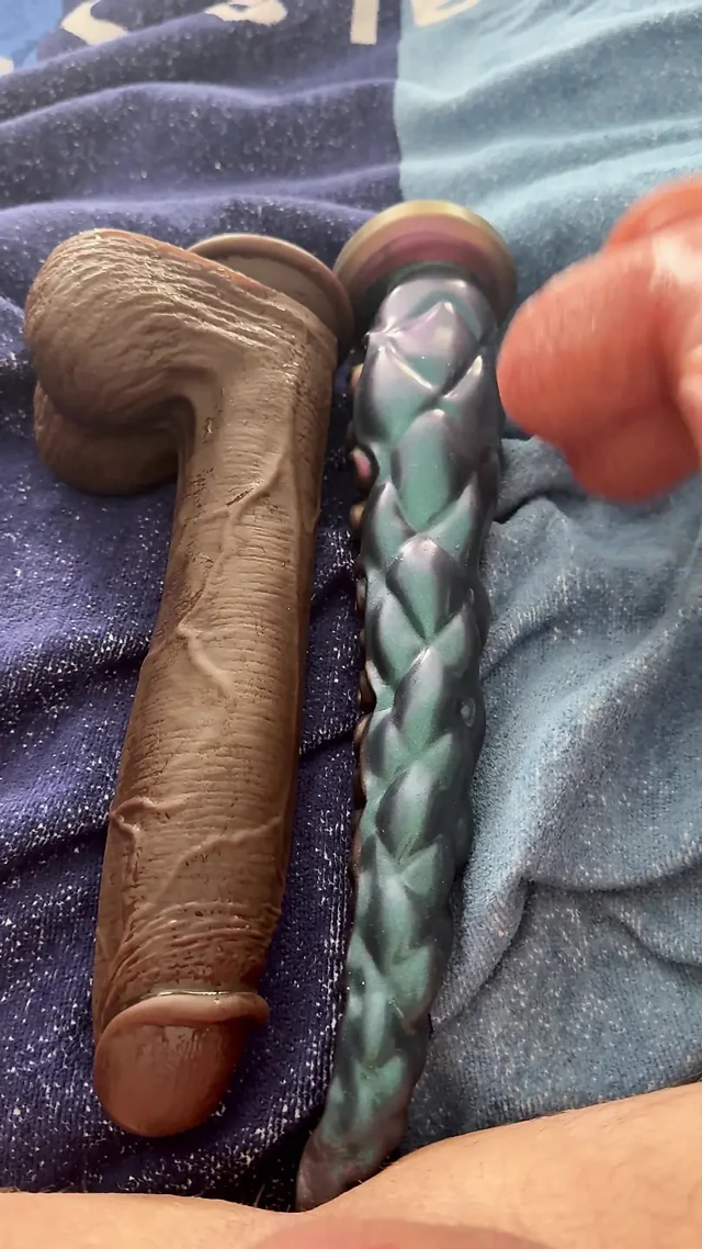 The latex titty slut pushes three monstrous dildos in a row!