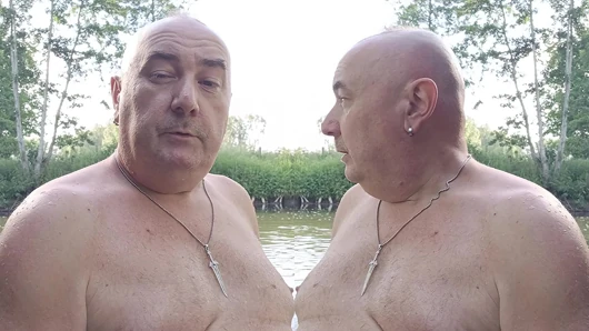 The plump, mustachioed daddy is having a blast in the stream, shamelessly masturbating with mud