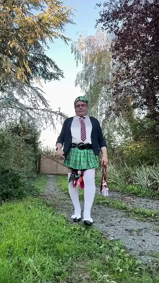 Dressed in a little plaid pleated skirt for a night out