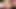 Curly-haired ladyboy with big boobs teases with her shaved