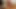 Mahkumun kel kafasını ateşli bir şekilde ağdalıyor
