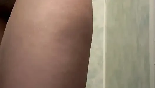 Wet girl caresses her body in the shower