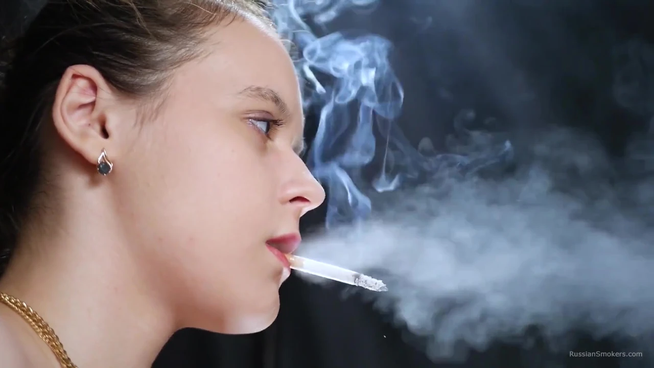 Topless Brunette Smoking in Dramatic Smoke