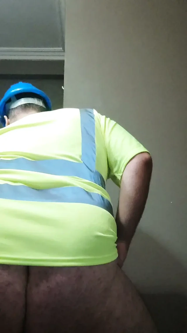 Construction bear stroking and shooting a load