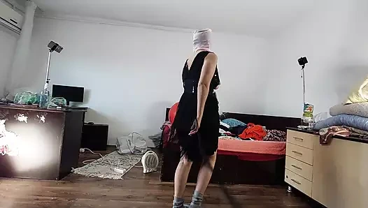 The sexy wife is having fun testing clothes and cuts them. The brunette dances naked through the house.