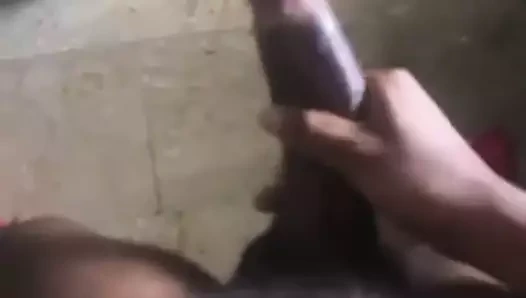Jerks off huge black cock