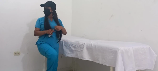 My nurse massages her pussy and moans with pleasure in her office