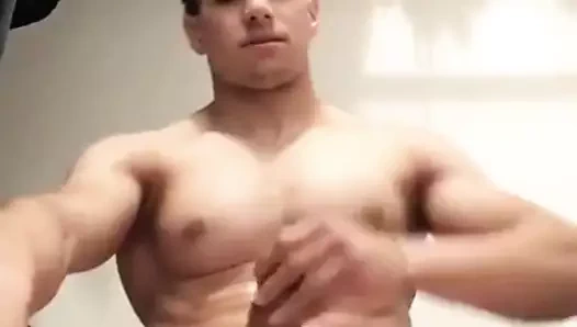 Muscle hunk jerks his fat cock