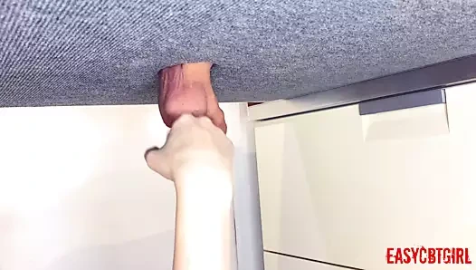 Mistress tickles the slave's balls with her fists and slaps