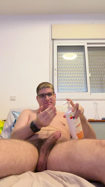 24yo boy naked and masturbating with body lotion in his bed