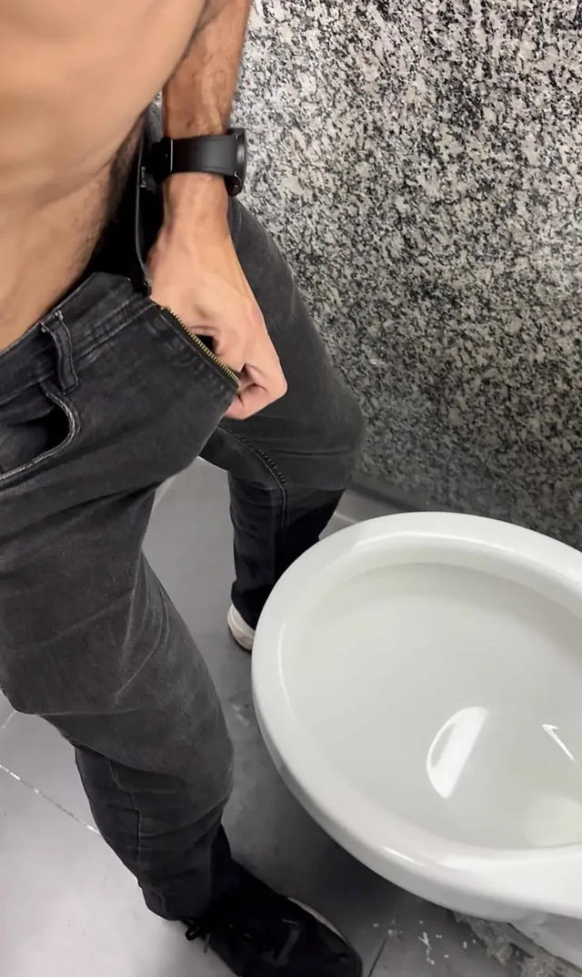 Hairy daddy's thick 9-inch cock exploding in the bathroom freeballing in jeans
