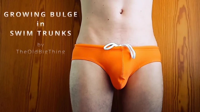 growing bulge in orange swim trunk - what every boy fears and girls dreaming of