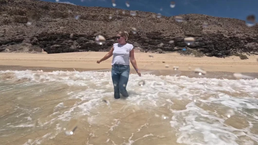 Girl Wetting Jeans in the Ocean and Swimming in Wet White T-shirt