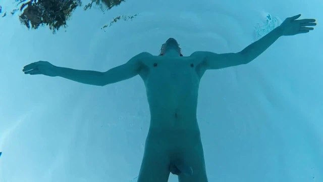 Indoor public pool solo uncut nude fit man swimming