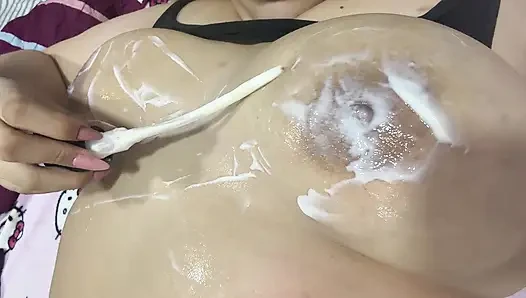 Mom massages her big tits with a very delicious cream