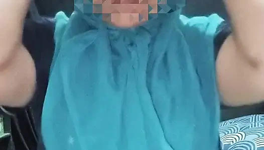 Blue hijab Muslim woman with seductive black t-shirt