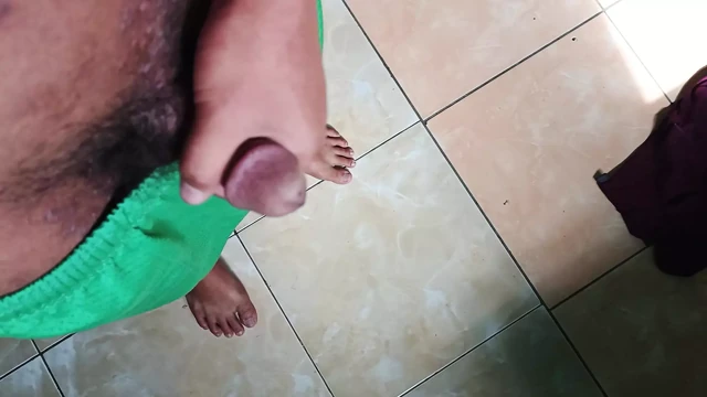 a young man masturbating in a quiet kitchen