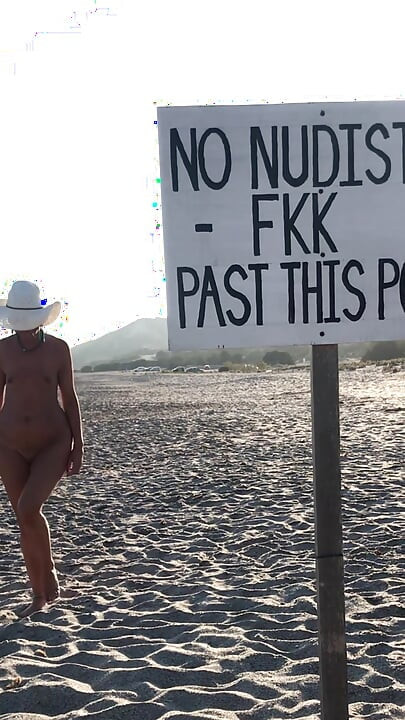 She pisses on the nudist beach