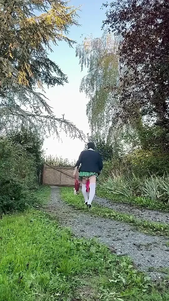 Dressed in a little plaid pleated skirt for a night out