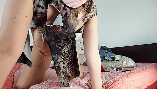 Amateur wife has fun trying on clothes that she tears.