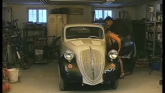 Blonde whore gets fucked by a black cock on the hood of the car