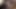 Kaltak uzun bir dildoyla amını sikerken parmaklarını kıvırıyor