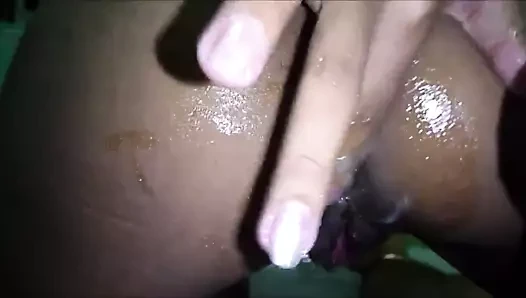 Filipina cramming fingers up her asshole