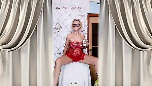 Hot housewife Lukerya flirts over morning coffee in a red mesh dress.
