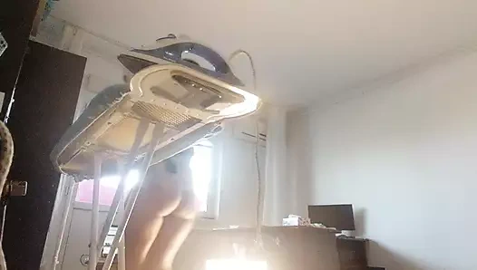 Sexy wife doing housework naked. Brunette, hairy pussy, big ass, big tits. Sexy mom massages herself with a vibrator.