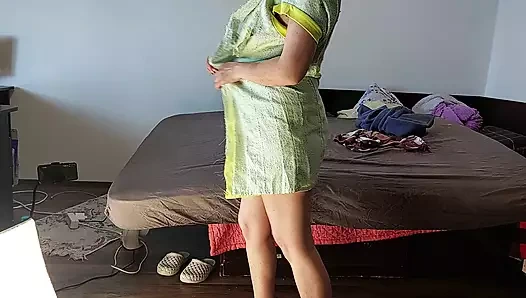 Amateur wife has fun trying on clothes and cutting.