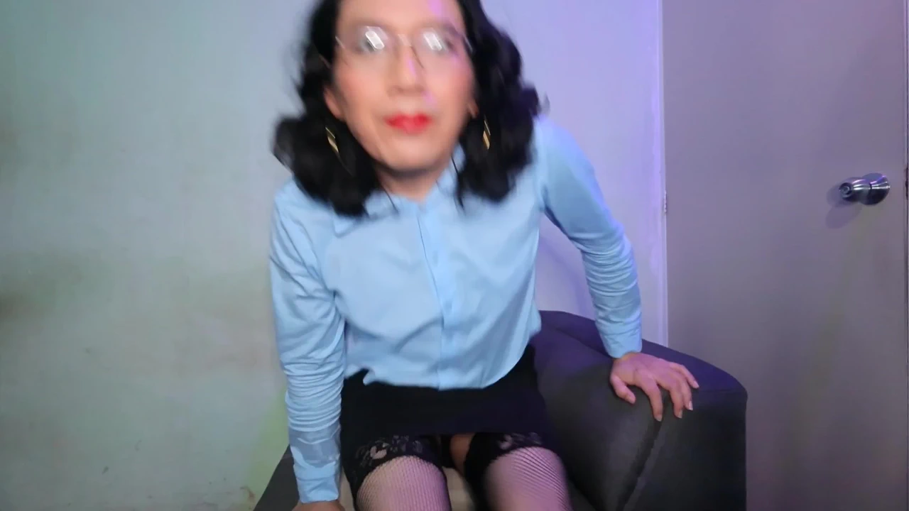 With two dildos in his mouth.