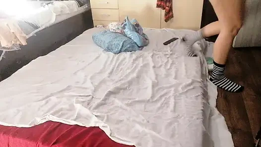 Sexy brunette doing naked chores around the house.