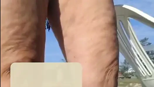 Hot crown sunbathing on the beach in transparent micro bikini