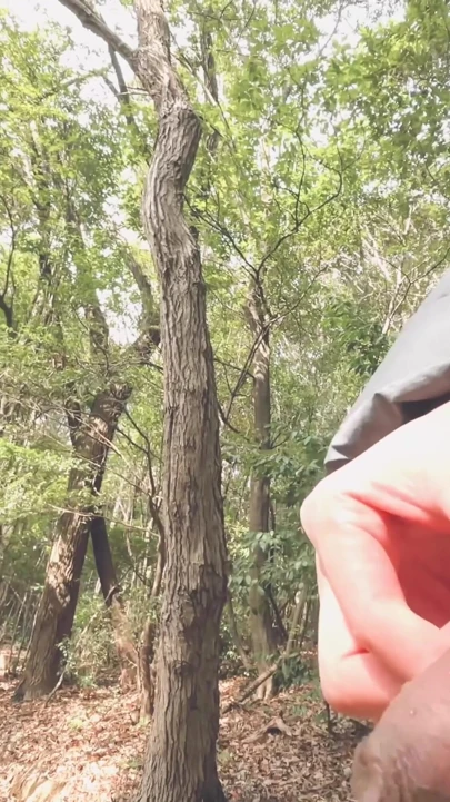 A boy with a small foreskin pees a huge stream outdoors | Clip 1